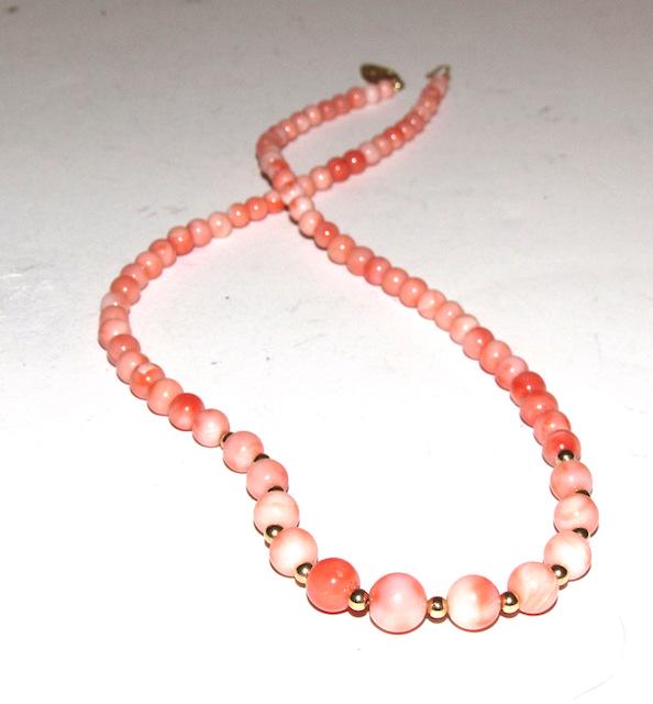14K Angel Skin Coral Necklace: 14K Angel Skin Coral Necklace. Classic singe trand design. 17 3/4" long. Stunning piece