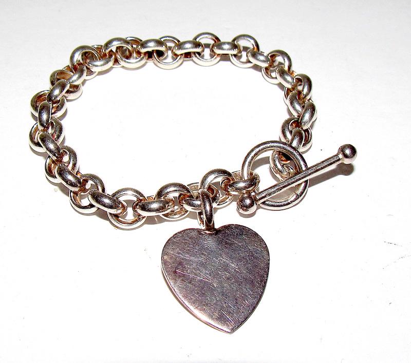 925 Rolo Chain Style Bracelet Heart Charm: 925 Rolo Chain Style Bracelet with Heart Charm. Marked and tested 925. 8" long, 18 grams