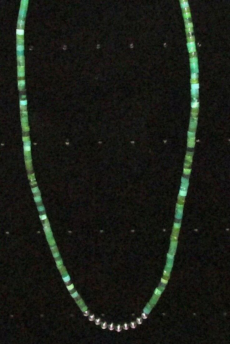 Navajo Rolled Turquoise & Sterling Beads Heishi Choker: Stunning Navajo Kingman turquoise small rolled beads and sterling silver beads choker necklace with sterling silver clasp. Measures about 18" long. Gorgeous, elegant piece that is sure to complement a