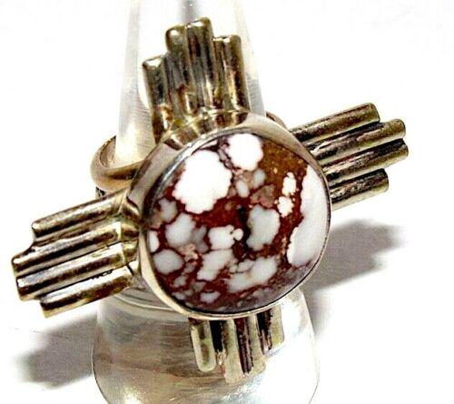 Navajo ADAM FIERRO Sterling WILD HORSE Stone Zia Cross: Navajo, highly collectible, award winning Adam Fierro Zia cross adjustable ring. The front of the ring measures about 1.5" by 1.5" with a stunning, large Wild Horse stone cab in the middle. The stone 