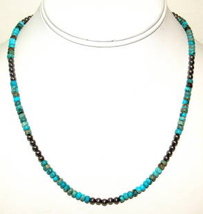 Navajo Rolled Turquoise & Navajo Pearls Heishi Choker Necklace Native 18L: Stunning Navajo Kingman turquoise small rolled beads and sterling silver beads Navajo pearls choker necklace with sterling silver clasp. Measures about 18" long. Rolled turquoise bead color and matrix