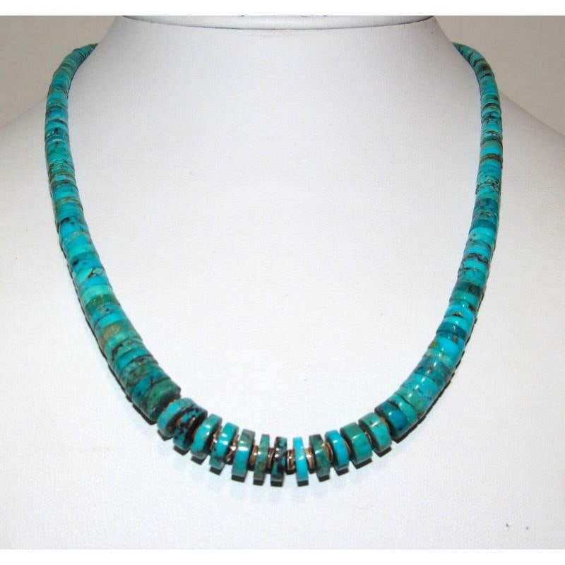 Santo Domingo Kingman Turquoise Heishi Necklace J. Calabaza 20": Stunning Santo Domingo sterling silver and hand cut, hand strung Kingman mine turquoise disc heishi necklace by the Santo Domingo artist Jeanette Calabaza. This stunning heishi necklace features a tra