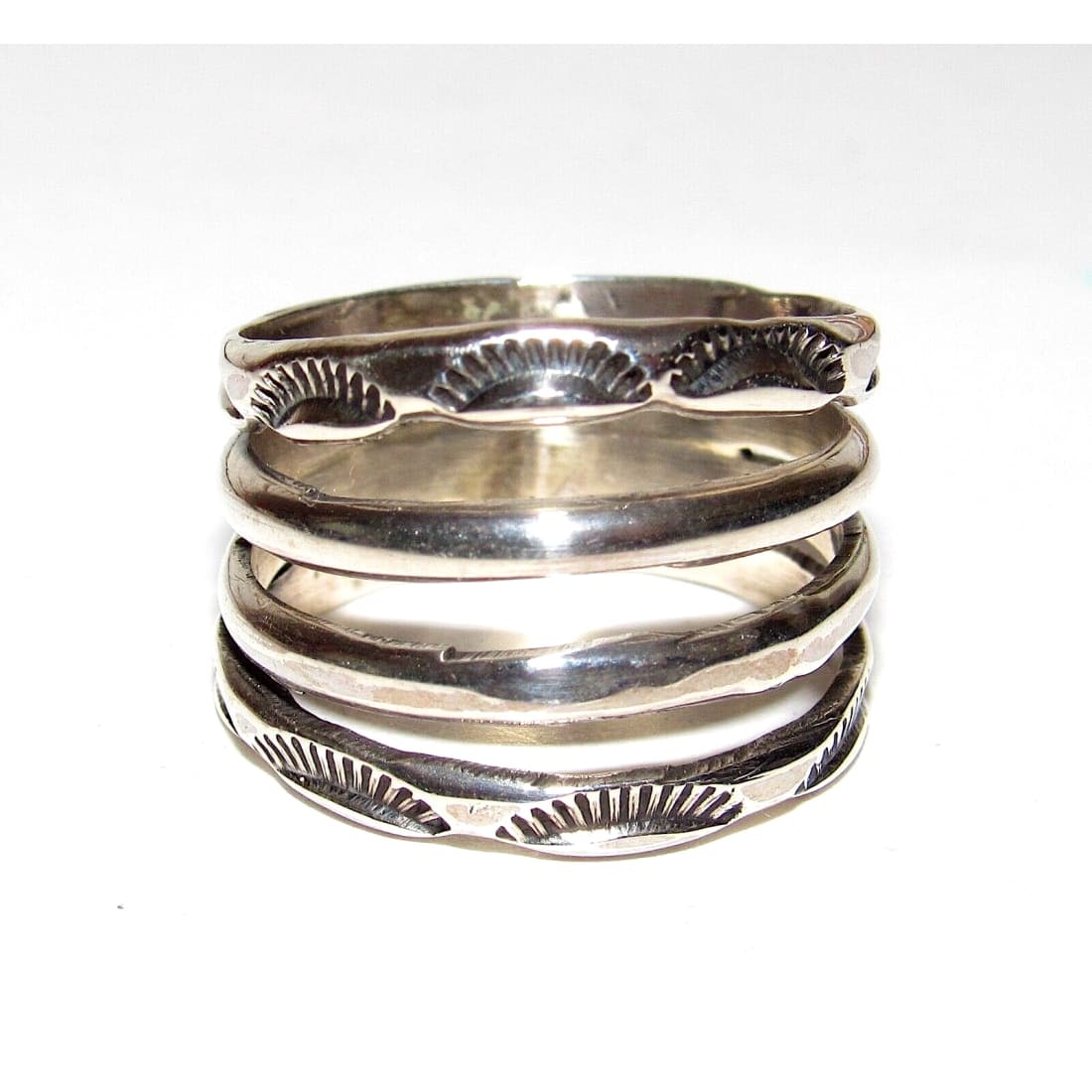 Navajo Band Stacker Ring Size 8 Sterling Silver Ingot Band Rob Cadman: Fab Native American Navajo sterling silver ingot hand etched and stamped tribal design band stacker ring by the Navajo artist Rob Cadman. The ring is size 8. Measures about 5/8" wide at the widest poi