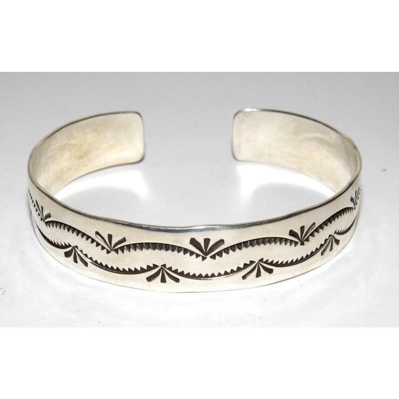 Navajo Sterling Silver Stacker Cuff Bracelet Ingot Gary Sandoval: Fab sterling silver Native American Navajo stacker cuff bracelet by the Navajo artist Gary Sandoval. The cuff is about 1/2" wide with hand stamped ingot tribal design. The inside circumference is abou