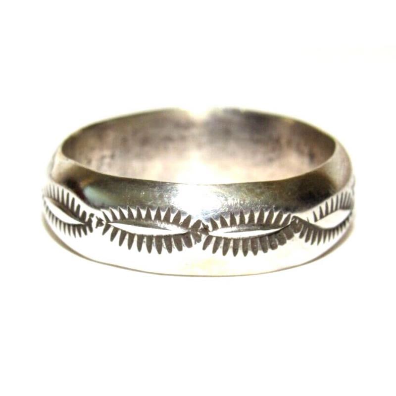 Navajo Band Ring Size 9 Sterling Silver Band Rob Cadman: Native American Navajo sterling silver ingot hand etched and stamped tribal design band ring by the Navajo artist Rob Cadman. The ring is size 9. Measures about 1/4" wide at the widest point. Stamped 