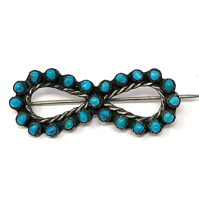 Old Pawn Zuni Snake Eye Turquoise Brooch Pin Sterling Silver: Wonderful traditional vintage Zuni snake eye turquoise small round brooch/pin.Measures about 1 1/2".Traditional design.Unmarked as most vintage Native pieces and has been tested for silver content.Goo