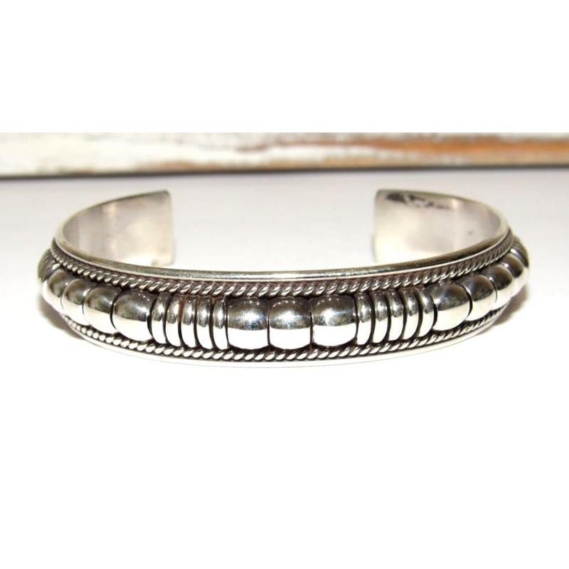 Navajo Sterling Silver Cuff Bracelet Tom Charley Native American Stacker: Wonderful Navajo sterling silver cuff bracelet by the Navajo artist Tom Charley. The cuff measures about 1/2" wide and the inside circumference is about 6 1/2" including a 1 1/4" gap. Signed by the ar