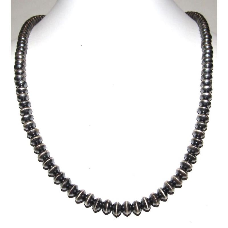 Navajo Pearls Necklace Sterling Silver Saucer Beads Necklace 20"L S. Whittington: Stunning classic Navajo pearls necklace with 6mm saucer beads design by the Navajo artist Sandra Whittington. Measures about 20" long. Hook & eye closure. Gorgeous, elegant & timeless necklace that is