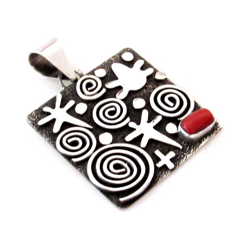 Massive Navajo Alex Sanchez Petroglyph Pendant Sterling Silver Coral: Phenomenal massive Navajo sterling silver & Mediterranean coral petroglyph design pendant by the highly collectible Navajo artist Alex Sanchez.The pendant measure about 2 1/2" long including the bail.