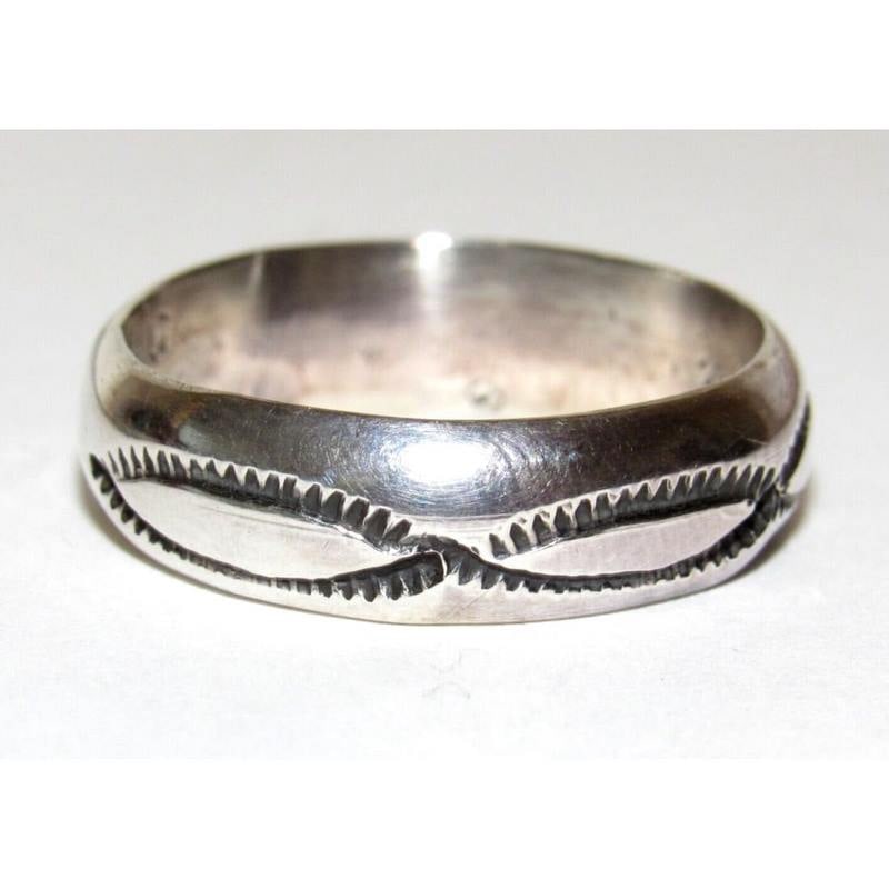 Navajo Band Ring Size 9.5 Sterling Silver Band Rob Cadman: Native American Navajo sterling silver ingot hand etched and stamped tribal design band ring by the Navajo artist Rob Cadman. The ring is size 9.5. Measures about 1/4" wide at the widest point. Stampe