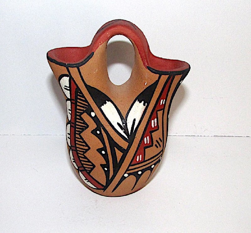Jemez Pueblo Wedding Vase Mini: Jemez Pueblo Wedding Vase Mini. 4" tall. Signed. This wedding vase is a traditional clay piece created by the artisan from the Jemez Pueblo in New Mexico. Wedding vases are distinctive ceremonial vess