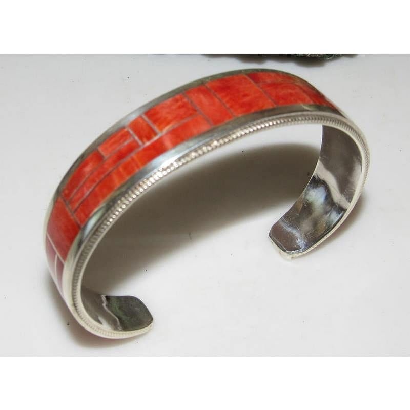 Navajo Red Orange Spiny Inlay Stacker Cuff Bracelet Sterling R. Begay: Fab Native American Navajo sterling silver and red orange spiny oyster inlay cuff bracelet by the Navajo artist Reginda Begay.. Traditional inlay design of gorgeous purple spiny in sterling silver. Gr