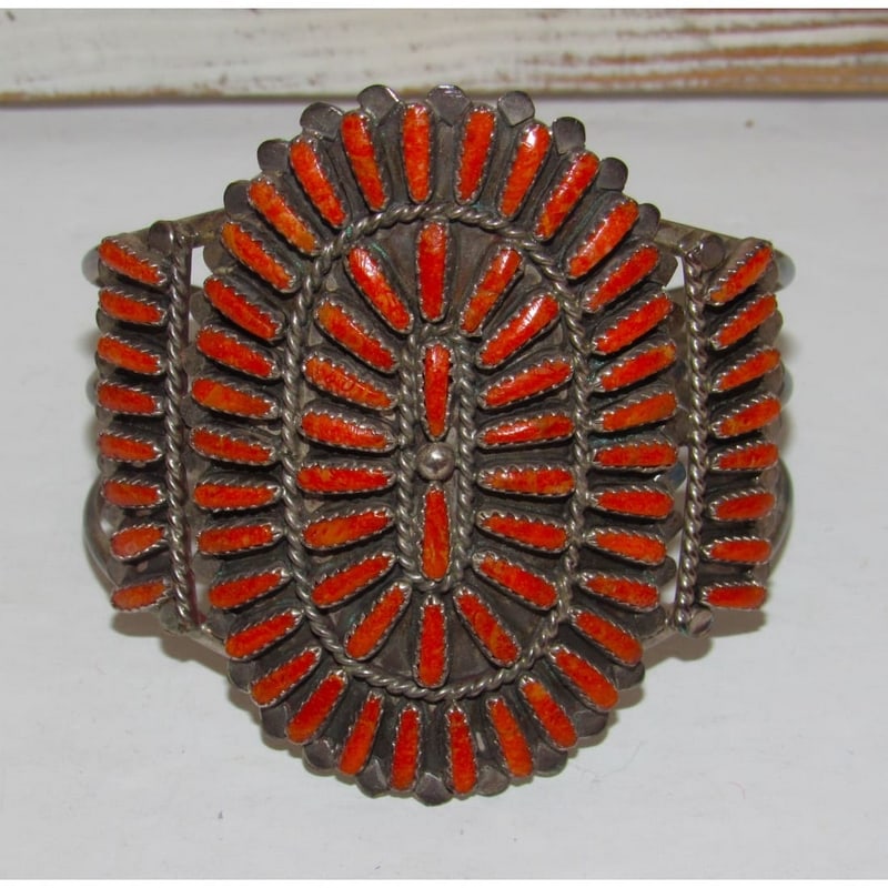 Old Pawn Navajo Coral Cluster Cuff Bracelet Sterling Silver Lavell Byjoe: This stunning vintage Navajo cuff by Lavell Byjoe features a striking coral cluster design in sterling silver. Arranged in a classic Navajo cluster pattern, the stones create a bold and eye-catching s