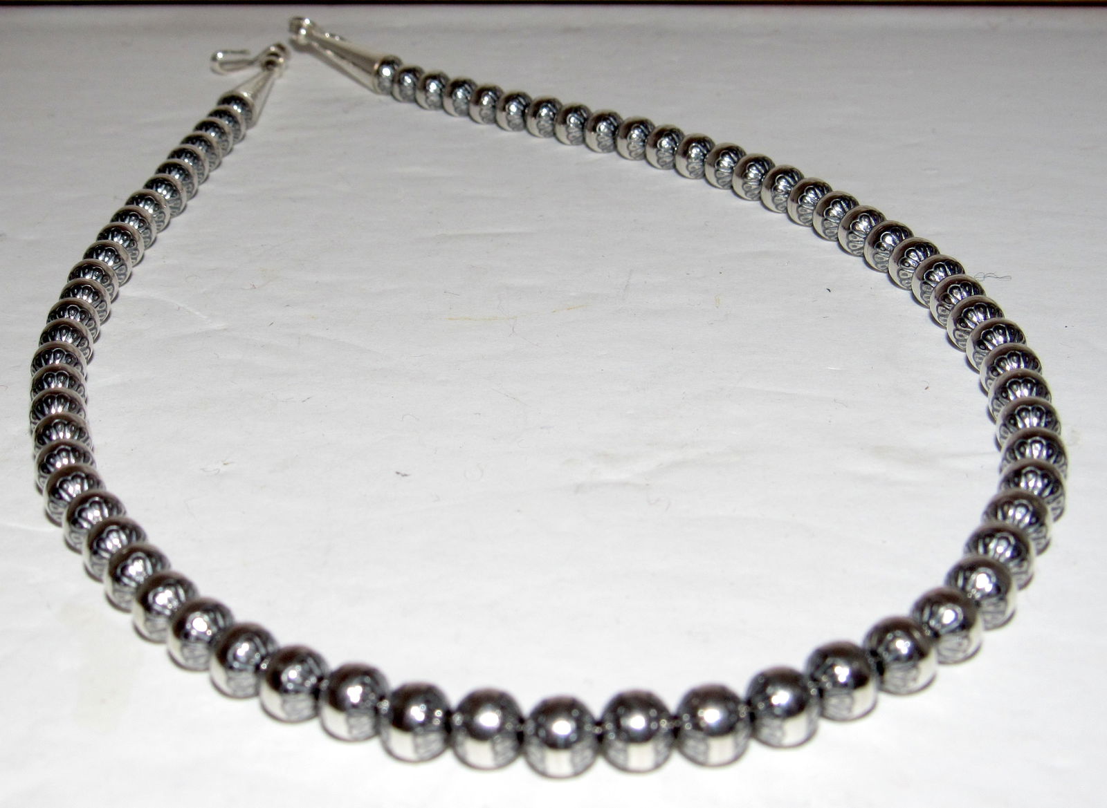 6mm Navajo Pearls Necklace Sterling Silver Stamped Beads Choker Necklace 18"L: Stunning 6mm sterling silver stamped tribal design beads Navajo pearls choker necklace. Measures about 18" long. Gorgeous, elegant & timeless piece that is sure to complement any outfit. Wonderful gif