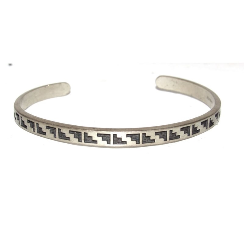 Vintage Southwestern Sterling Silver Aztec Motif Tacker Cuff Bracelet: Vintage Southwestern Sterling Silver Aztec Motif Tacker Cuff Bracelet. The bracelet measures approximately 7 inches in inner circumference, fits a medium wrist. Rich with cultural symbolism and tradit