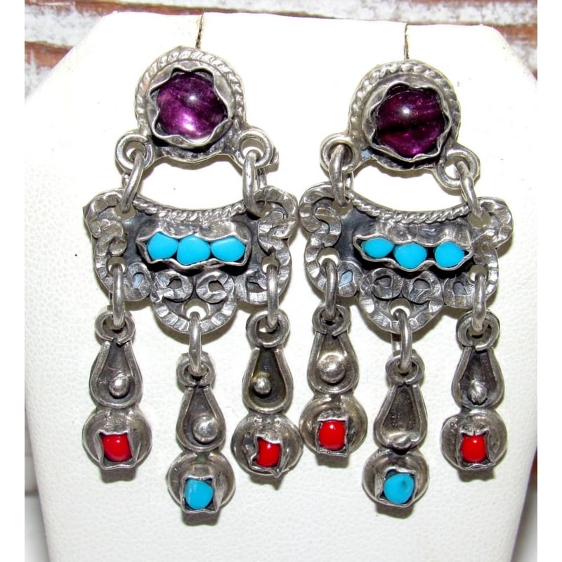 Vintage Taxco Mexico Sterling Silver Turquoise Coral Amethyst Accents Dangle Earrings: These vintage Taxco Mexico sterling silver dangle earrings showcase classic mid-century Mexican silversmithing with bold turquoise, coral, and amethyst accents set against hand-worked silver. The laye