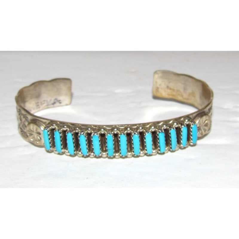 Vintage Zuni Sleeping Beauty Turquoise Cuff Bracelet Sterling Silver Stacker: Traditional vintage Native American Zuni hand etched cuff bracelet with a row of petit point Sleeping Beauty Mine turquoise cabochons on the front. Wonderful craftsmanship accented with a row of petit