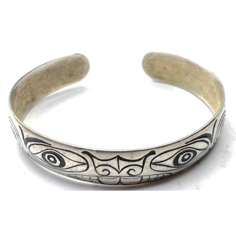 Vintage Northwestern Sterling Silver Animal Motif Cuff Bracelet: Vintage Northwestern Sterling Silver Animal Motif Cuff Bracelet. Crafted in sterling silver, this bold cuff showcases hand-etched stylized northwest animal motif detailing. The bracelet measures appro