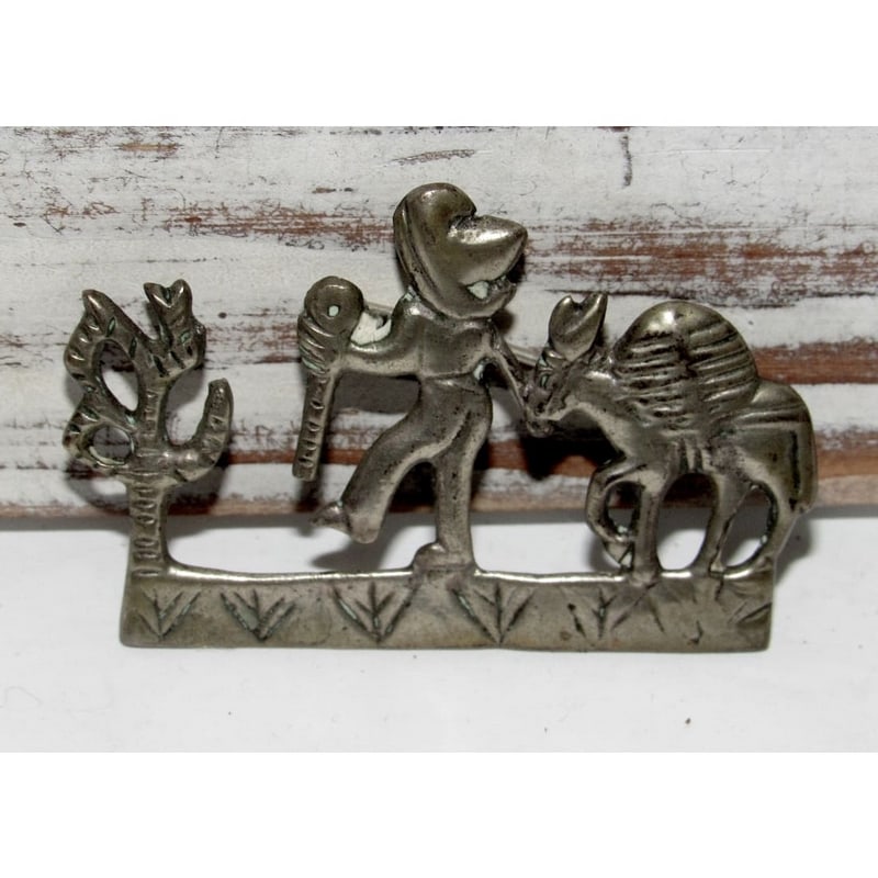 Vintage Taxco Mexican 800 Silver Cowboy Vaquero Donkey Brooch Pin: Vintage Taxco Mexican 800 Silver Cowboy Vaquero Donkey Brooch Pin. The brooch measures approximately 1 3/4" inches in length. A wonderful example of Mexican collectible jewelry, appealing to collector