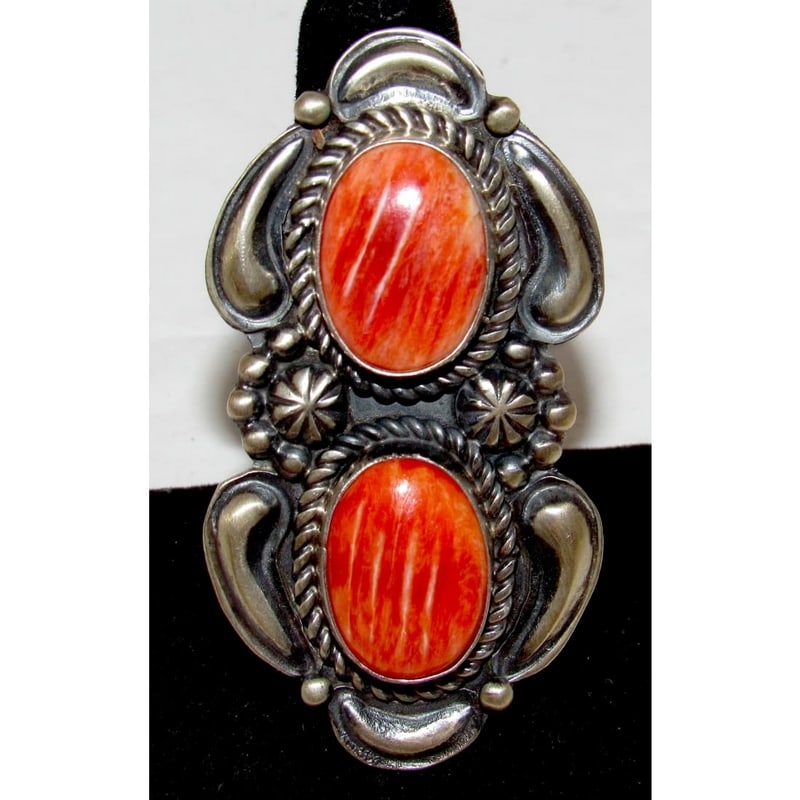 Massive Navajo Red Spiny Oyster Ring Sz 7.5 Sterling Silver J James: Introducing the striking Navajo Sterling Silver and Red Spiny Oyster Ring, handcrafted by the talented Navajo artist Jeff James Jr. This statement piece in size 7.5, measures approximately 2.5" in len