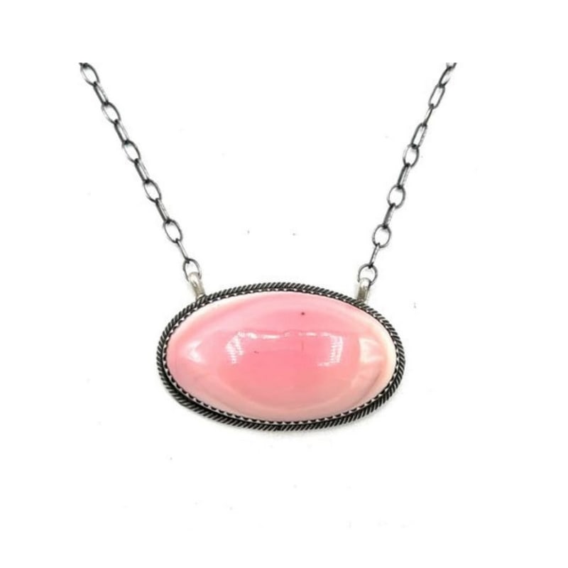 Navajo Pink Conch Bar Necklace Sterling Silver T. Long: Navajo Pink Conch Bar Necklace Sterling Silver T. Long. The necklace features a stunning pink conch shell cabochon delicately set in sterling silver, creating a mesmerizing display of color and textur