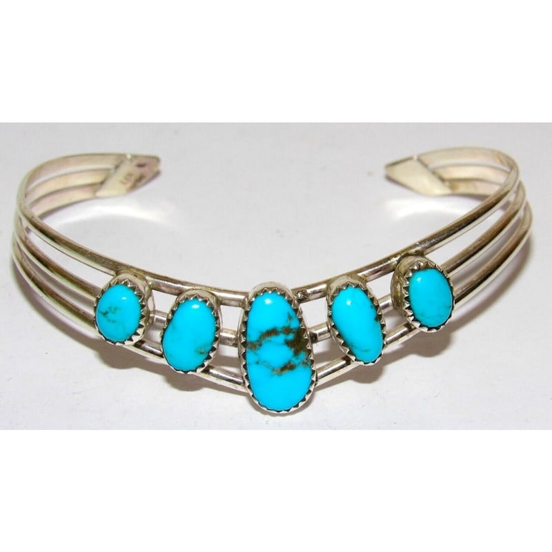 Navajo Kingman Turquoise Bracelet Sterling Silver Cuff V-Shaped Design: For your consideration is this fab vintage Navajo sterling silver and Kingman turquoise cuff bracelet by the Navajo artist James McCrae. The cuff features a traditional, elegant V-shaped design in ste