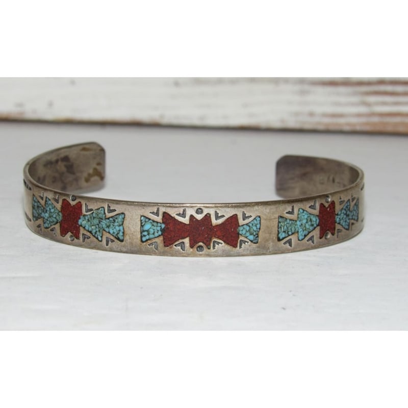 Vintage Navajo Turquoise Coral Inlay Stacker Cuff Bracelet Sterling Silver: Introducing this fab vintage Navajo Sterling Silver Turquoise Coral Inlay Stacker Cuff Bracelet, a captivating creation by the Navajo artist. This exquisite piece adds vibrant colors and authentic art