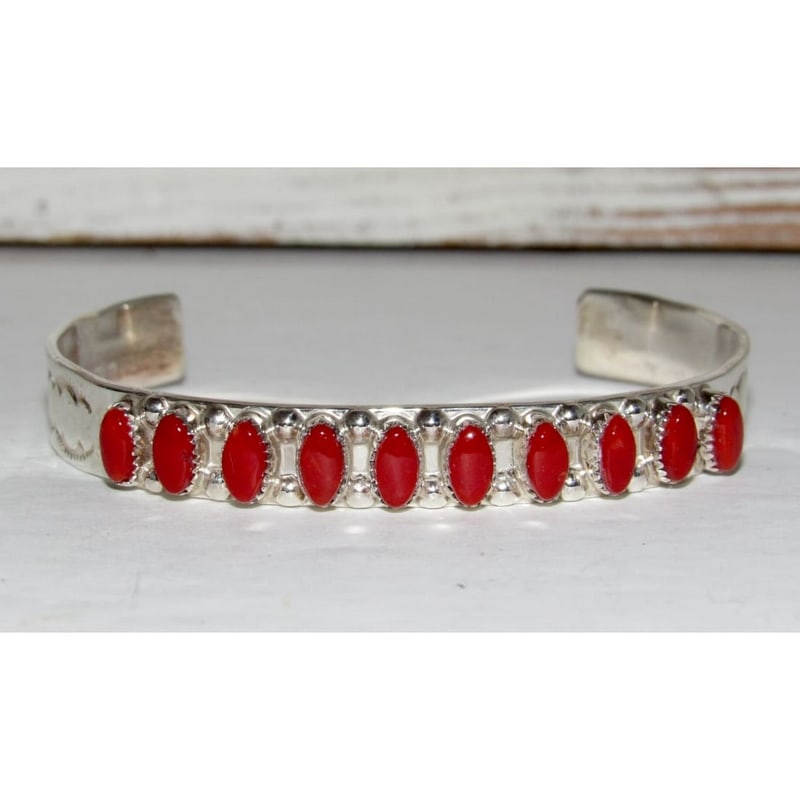 Zuni Coral Cuff Bracelet Sterling Silver Stacker Native American Coonsis: Traditional Native American Zuni hand etched cuff bracelet with a row of coral cabochons on the front by the Zuni artist H. Coonsis. Wonderful craftsmanship accented with a row of coral cabochons on t