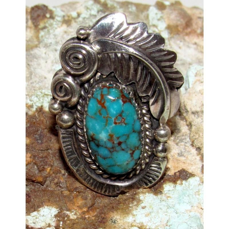 Navajo Number 8 Blossom Turquoise Ring Size 8.5 Sterling Silver Signed: Navajo Number 8 Turquoise Ring Size 8.5 Sterling Silver Signed. For your consideration is this stunning Navajo sterling silver, and Number 8 turquoise ring size 8.5. Traditional squash blossom design.