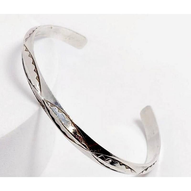 Old Pawn Navajo Carinated Stacker Cuff Bracelet Ingot Sterling Silver: For your consideration is this classic example of vintage Navajo jewelry. The bracelet features a traditional carinated cuff design in sterling silver accented with hand stamped ingot tribal design. A