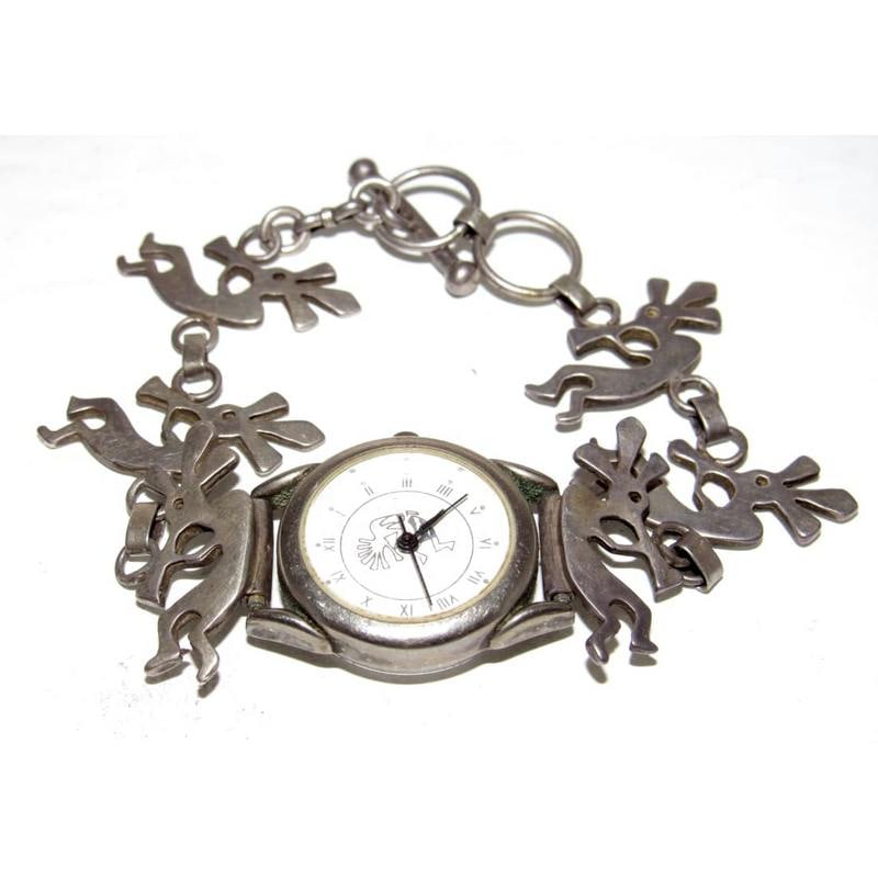 Vintage Navajo Sterling Silver Kokopelli Watch – Southwest Native American Design: Vintage Navajo sterling silver watch featuring a linked bracelet design with repeating Kokopelli figures, a well-known symbol in Southwestern and Native American art representing fertility, joy, music