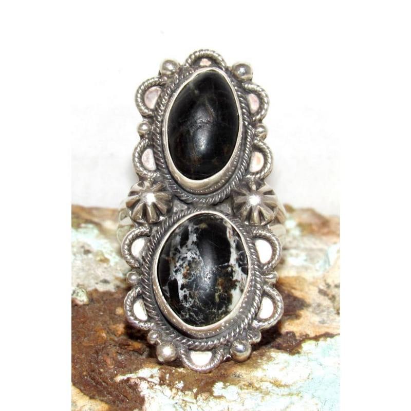 Navajo White Buffalo Ring Sz 9 Adjustable Sterling Silver Signed: Navajo White Buffalo Ring Sz 9 Adjustable Sterling Silver Signed. Navajo sterling silver White Buffalo ring featuring two White Buffalo cabochons with striking black and white matrix. Handcrafted in t