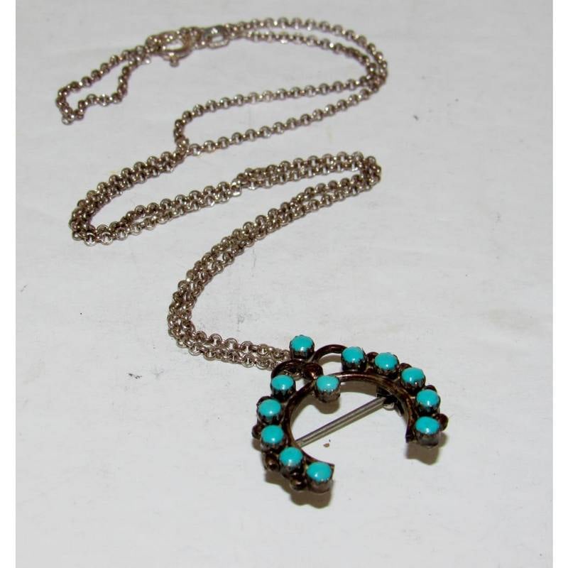 Old Pawn Zuni Snake Eye Turquoise Naja Pin Pendant Necklace: Old Pawn Zuni sterling silver snake eye turquoise naja pin/pendant on a sterling silver chain necklace. This vintage Zuni piece features classic snake eye turquoise stones set in a traditional naja fo