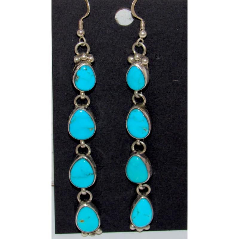 Navajo Kingman Turquoise Dangle Earrings Sterling Silver Marcella James: Elevate your style with the mesmerizing Sterling Silver and Kingman Turquoise Cascading Dangle Earrings by the talented Navajo artist Marcella James. These exquisite earrings feature four stunning Kin