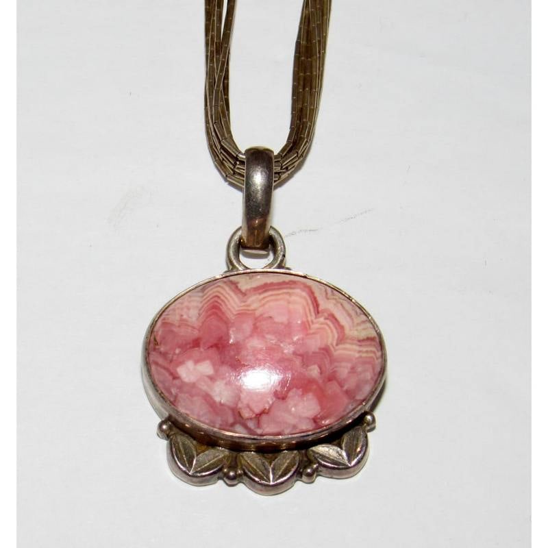 Vintage Southwestern Liquid Silver Necklace with Pink Rhodochrosite Pendant: Vintage Southwestern Liquid Silver Necklace with Pink Rhodochrosite Pendant. The necklace measures about 20" long. Wonderful southwestern necklace to add to any jewelry collection. Great for layering 