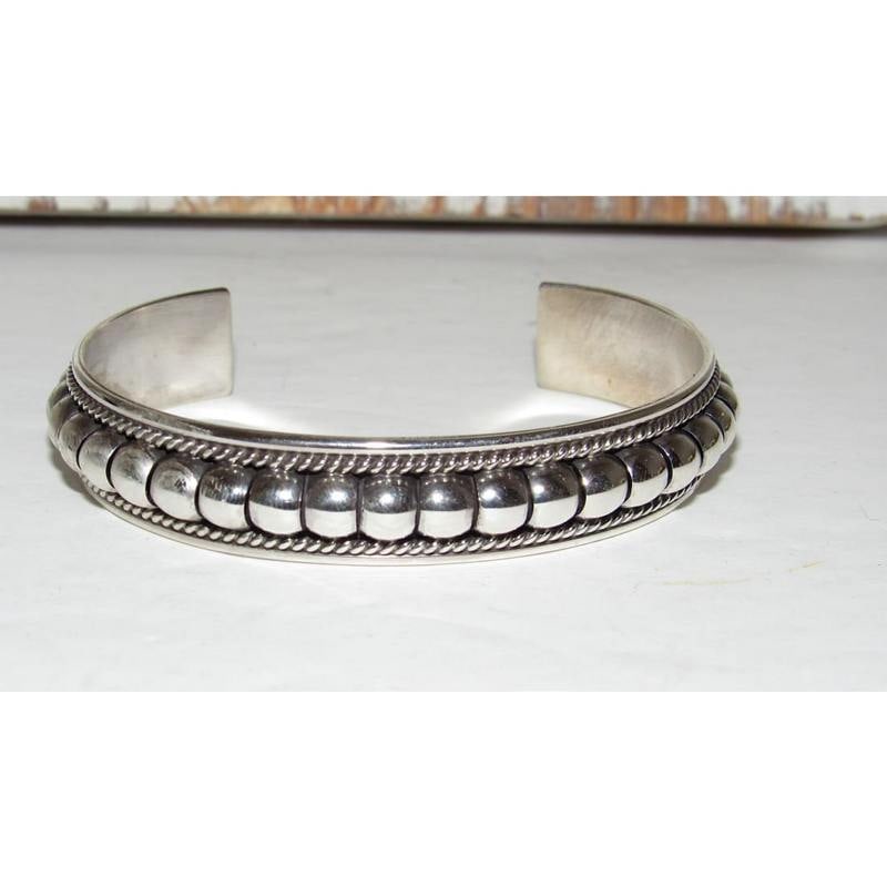 Navajo Sterling Silver Cuff Bracelet Tom Charley Native American Stacker: Wonderful Navajo sterling silver cuff bracelet by the Navajo artist Tom Charley. The cuff measures about 1/2" wide and the inside circumference is about 6 1/2" including a 1 1/4" gap. Signed by the ar
