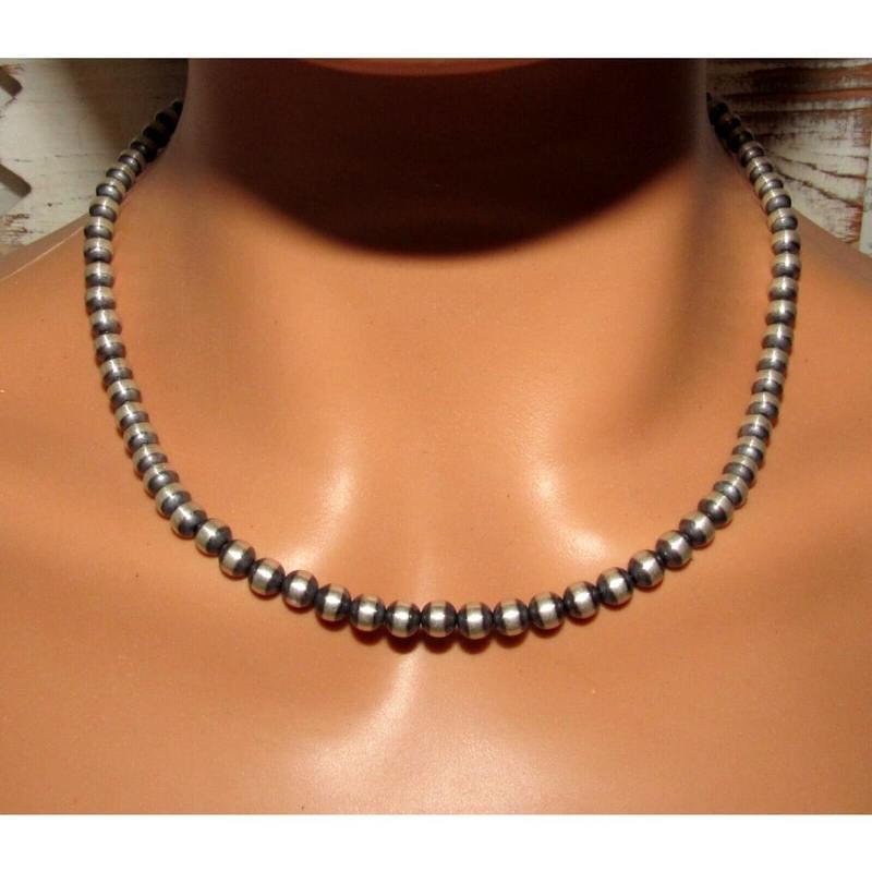 Navajo Pearls Necklace Sterling Silver 5mm Beads Necklace 18"L Choker: Classic Navajo pearls necklace with 6mm sterling silver beads design by the Navajo artist M Lee. Hook & eye closure. Measures 18" long. Gorgeous, elegant & timeless necklace that is sure to complement