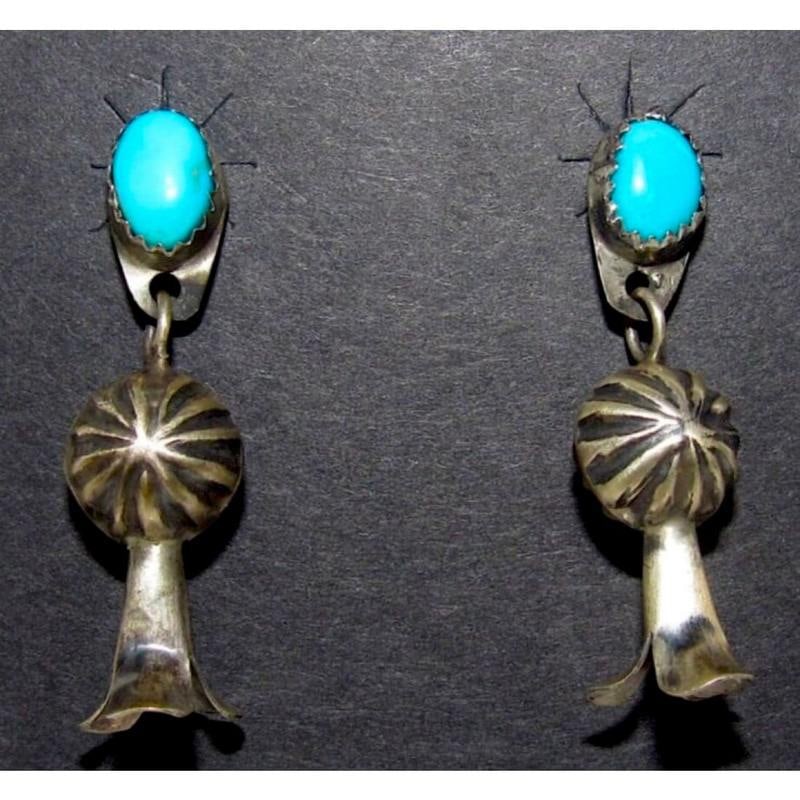 Navajo Squash Blossom Earrings Sterling Silver Turquoise Native American: Wonderful classic Navajo sterling silver and turquoise dangle squash blossom earrings. Sterling silver, small Sleeping Beauty mine turquoise cabochon at the top. Measure a little under 1 1/2". Navajo 