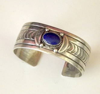 NAVAJO STERLING SILVER LAPIS CUFF BRACELET: For your consideration is this stunning piece of Native American Art. The sterling cuff bracelet was created by a well known Navajo artist, Leonard Platero. The piece features a stunning intricate