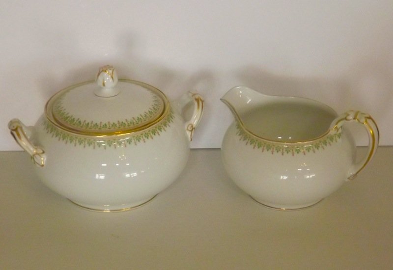 LIMOGES SET CREAMER AND SUGAR BOWL W/LID: ANTIQUE LIMOGES DEPOSE C. AHRENFELDT CREAMER AND SUGAR BOWL W/LID. No chips, cracks, repairs. NO BUYER PREMIUM. EASY IN HOUSE SHIPPING.