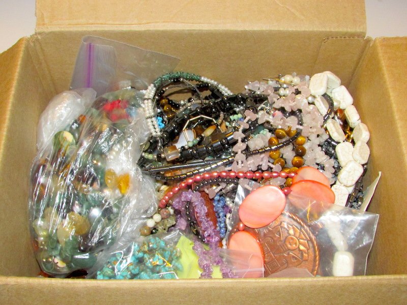 Large Semi Precious Jewelry Lot: Large Semi Precious Jewelry lot for re-sell, crafts, etc. Includes necklaces, earrings, bracelets loose stones, beads, and more. Lots of items and lots of potential in this box. Variety of crystals, t