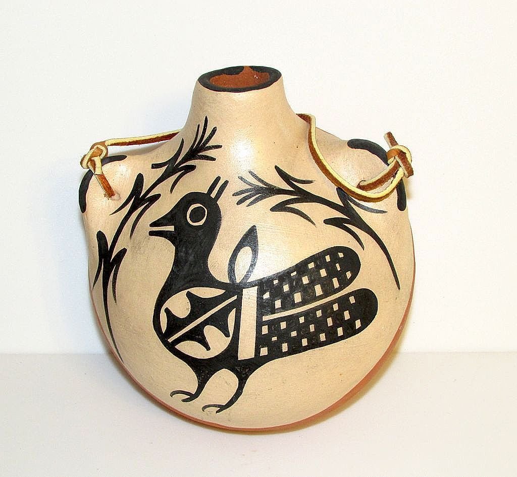 Native American Santo Domingo Pueblo Pottery Canteen: Vintage and rare Native American Santo Domingo pueblo water canteen in wonderful vintage condition by a highly collectable artist Anna Marie Lovato. This gorgeous piece is circa 1960 and features a tr