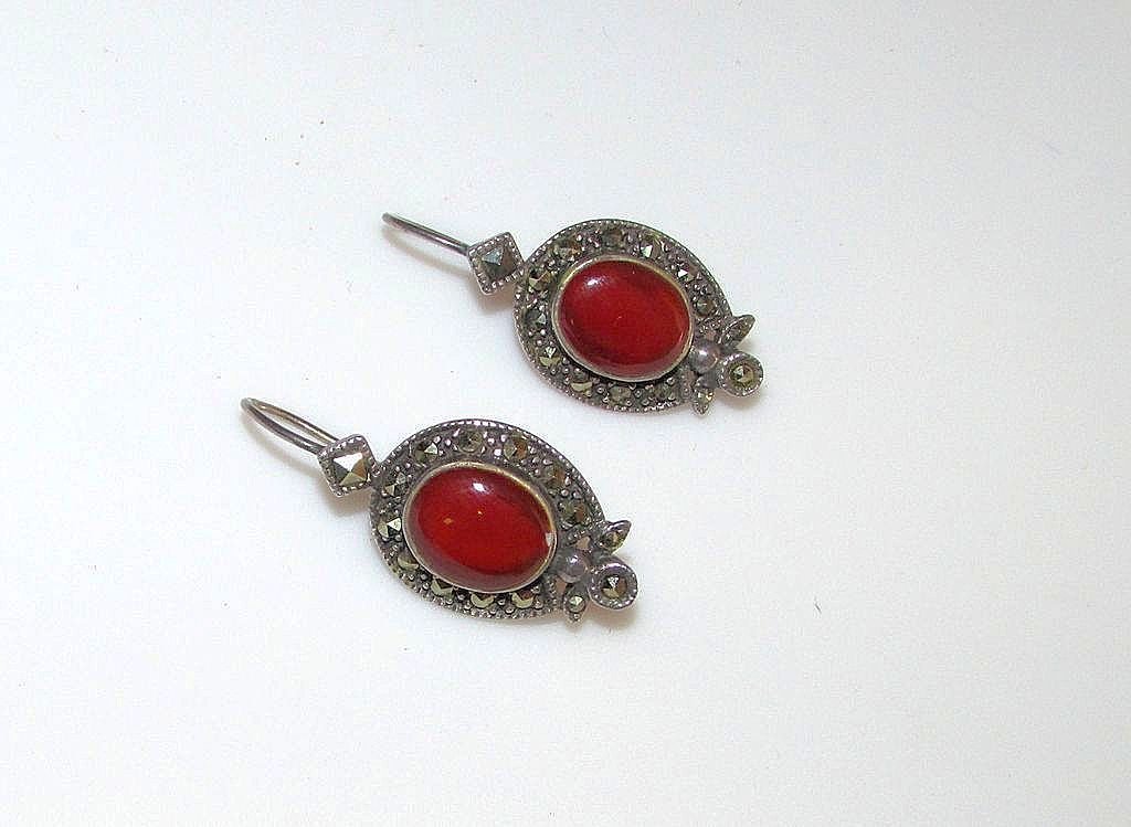 Sterling Silver Marcasite Carnelian Earrings: Vintage sterling silver carnelian pierced earrings in wonderful vintage condition. These beauties feature an interesting design in sterling silver accented with sparkly marcasites and gorgeous, deep r