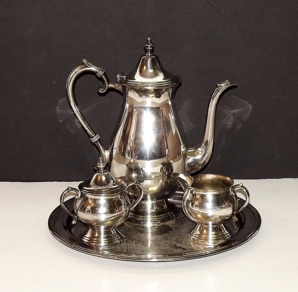 F.B. Rogers Silver Plated Tea/Coffee Service: For your consideration is this beautiful F.B. Rogers Silver Plated Tea/Coffee Service in wonderful condition. The set includes a Tea/Coffee Pot with lid, a creamer, a sugar bowl with lid, and a tray.