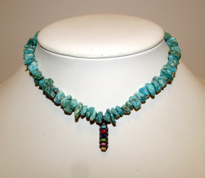 Turquoise Necklace Sterling Semi Precious Stone Pendant: Wonderful turquoise choker necklace with sterling silver and semi precious stones pendant. The pendant features coral, lapis, turquoise, etc. Pendant is marked and tested silver