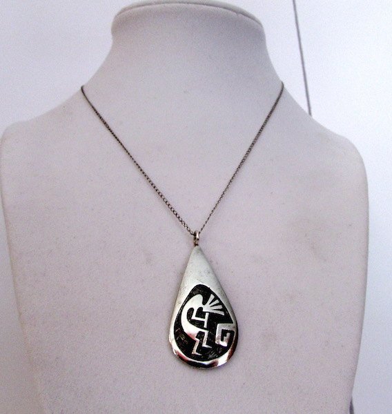 Vintage HOPI Native American Sterling Silver Kokopelli: Stunning vintage HOPI sterling silver Kokopelli pendant on a sterling silver necklace by the highly collectible artist Norman Honie. The pendant features a traditional, hand etched Kokopelli design wi