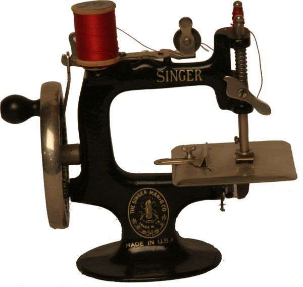 Singer Sewing Machine.: Cast iron and nickel in construction. Cond: Good to very good.