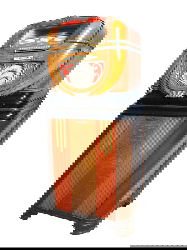 Model 71 Wurlitzer Jukebox on Original Stand.: Mahogany and art deco construction. Size: 57" tall. Cond.: Slight imperfections in wood, otherwise, in excellent condition.