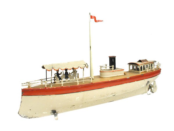 Carette Boat.: Early hand-painted German tin with clockwork motor. Size: 14 1/2" long. Cond: Some paint flaking throughout yet retains a good to very good overall look.
