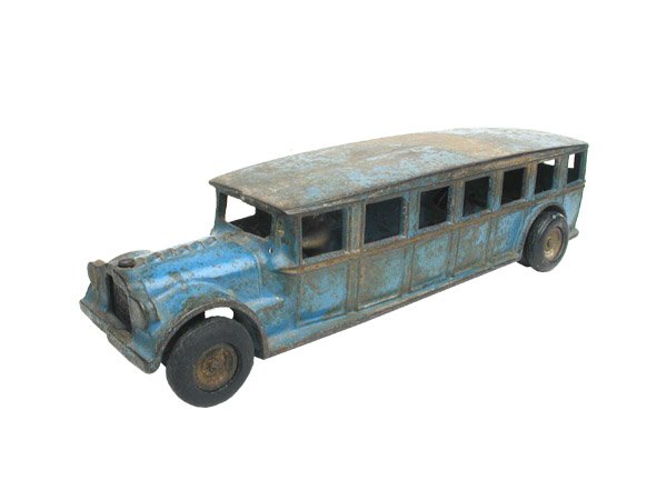 Arcade C.I. Fagol Bus.: With nickel plated driver and black rubber tires. Size: 12" long. Cond: Replaced front tires. Poor to fair original paint.